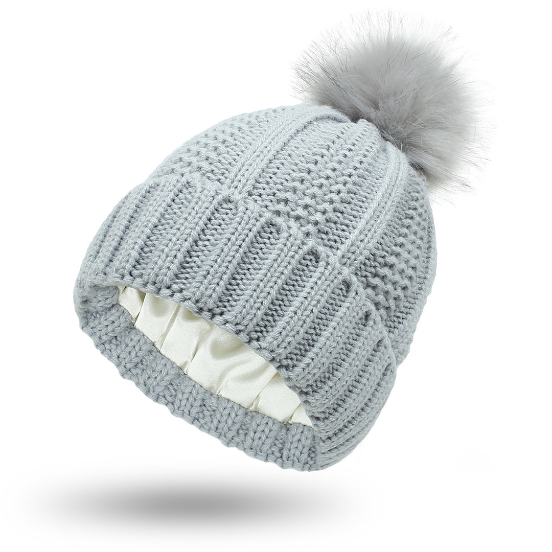 Damska czapka z pomponem z grubej dzianiny